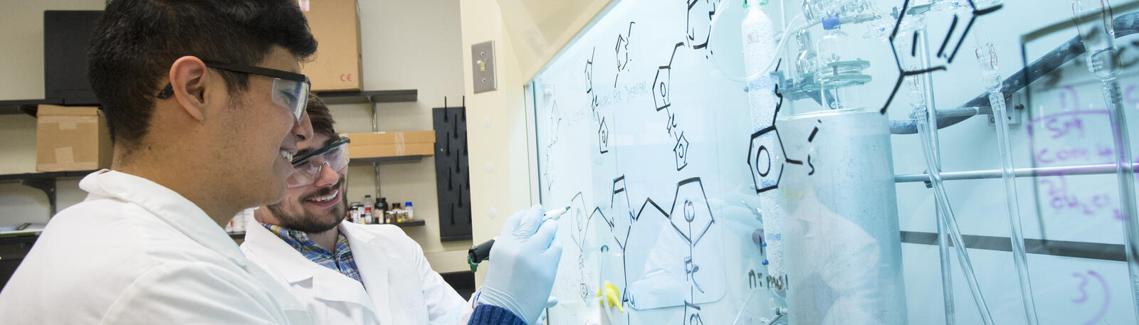 photo of two students working in a lab