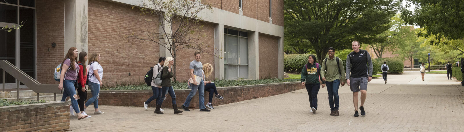 photo of students walking outside of fawcett hall