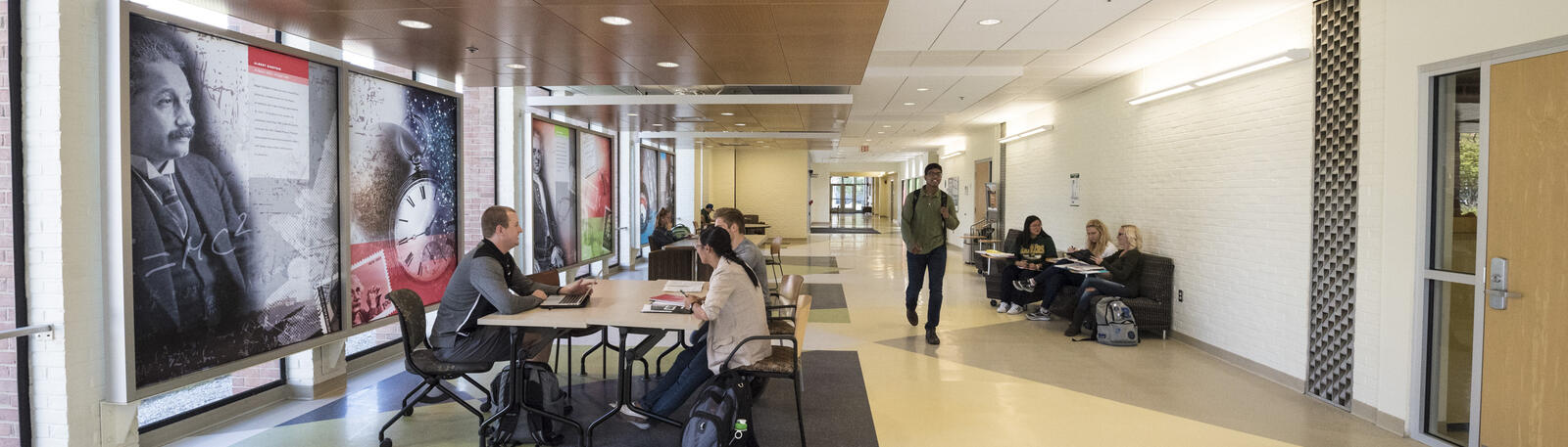 photo of students sitting and walking in fawcett hall