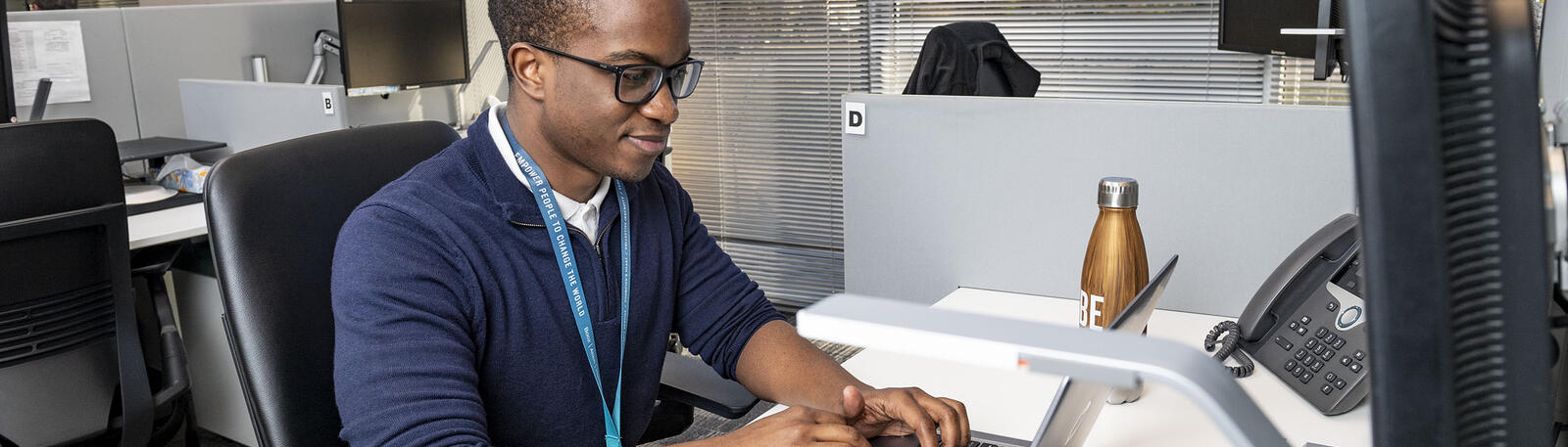 photo of an alum working in an office